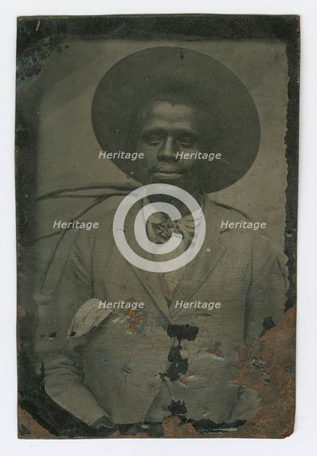 Tintype portrait of a man wearing a hat and suit, late 19th century. Creator: Unknown.