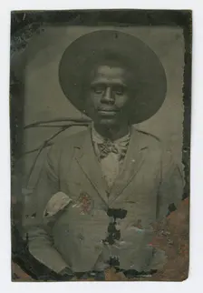 Tintype portrait of a man wearing a hat and suit, late 19th century. Creator: Unknown