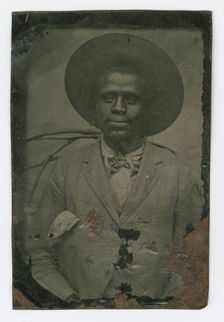 Tintype portrait of a man wearing a hat and suit, late 19th century. Creator: Unknown