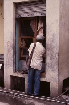 Tiny butcher's shop, McLeod Ganj, Dharamsala, India, 1988. Creator: Amanda Waite