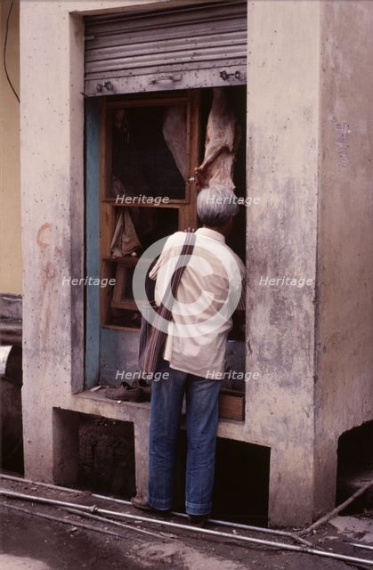 Tiny butcher's shop, McLeod Ganj, Dharamsala, India, 1988.  Creator: Amanda Waite.