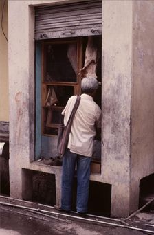 Tiny butcher's shop, McLeod Ganj, Dharamsala, India, 1988. Creator: Amanda Waite
