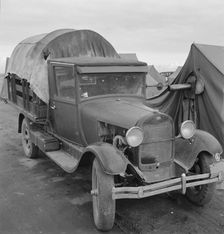 Truck, baby parked on front seat, Merrill, Klamath County, Oregon, 1939. Creator: Dorothea Lange
