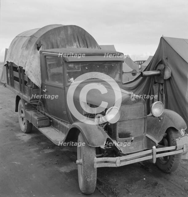 Truck, baby parked on front seat, Merrill, Klamath County, Oregon, 1939. Creator: Dorothea Lange.
