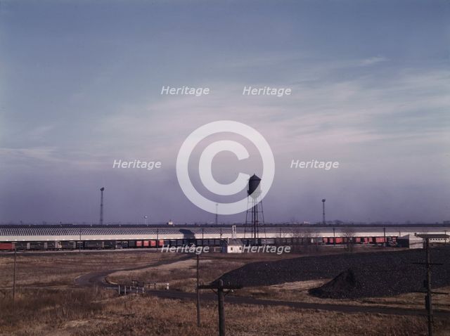 Truck trailers loading and unloading at C & NW RR's Proviso yard, Chicago, Ill., 1942. Creator: Jack Delano.