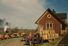 Trucks outside of a starch factory, Caribou, Aroostook County, Maine. , 1940. Creator: Jack Delano