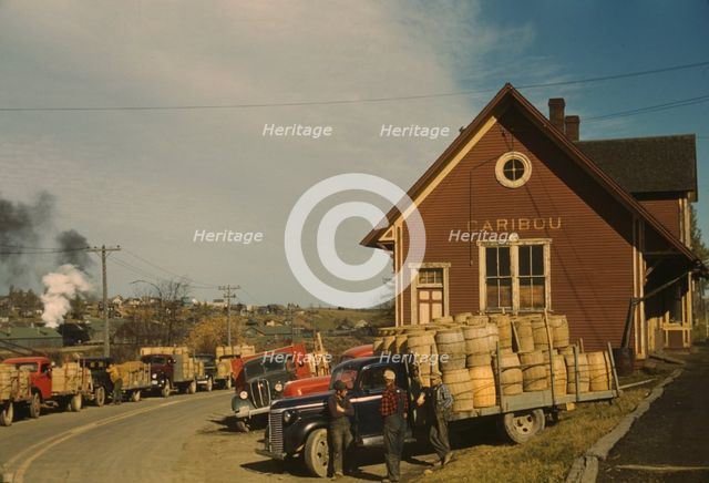 Trucks outside of a starch factory, Caribou, Aroostook County, Maine. , 1940. Creator: Jack Delano.