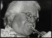 Trumpeter Henry Lowther playing at The Fairway, Welwyn Garden City, Hertfordshire, 1 October 2000. Creator: Denis Williams