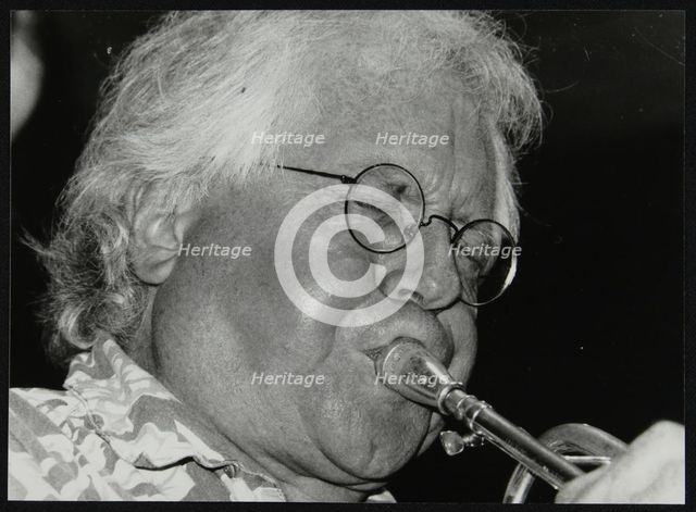 Trumpeter Henry Lowther playing at The Fairway, Welwyn Garden City, Hertfordshire, 1 October 2000. Artist: Denis Williams