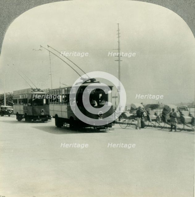 'Trackless Tram Cars in Singapore, Straits Settlement, British Malaya', c1930s. Creator: Unknown.