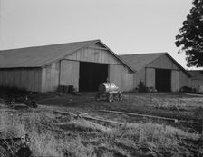 Tractor garage at the Aldridge Plantation near Leland, Mississippi, 1937. Creator: Dorothea Lange