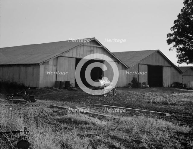Tractor garage at the Aldridge Plantation near Leland, Mississippi, 1937. Creator: Dorothea Lange.