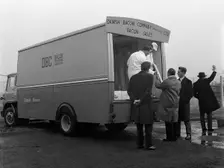 Traders buying bacon direct from a Danish Bacon wholesale van, Kilnhurst, South Yorkshire, 1961. Creator: Michael Walters