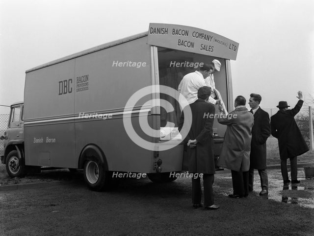 Traders buying bacon direct from a Danish Bacon wholesale van, Kilnhurst, South Yorkshire, 1961. Artist: Michael Walters