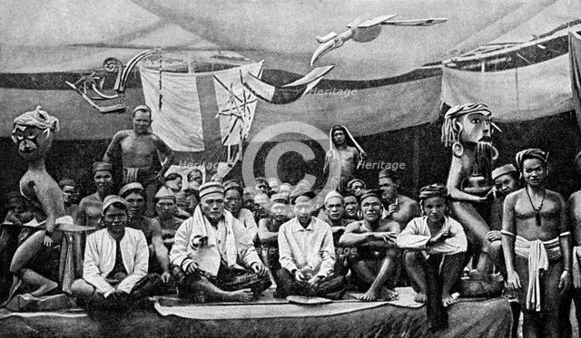 Traditional enemies assembled at a peace conference in Claudetown, Sarawak, c1899, (1922).Artist: Dr Charles Hose