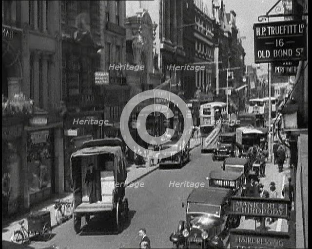 Traffic and Crowds Moving Through Old Bond Street, 1930s. Creator: British Pathe Ltd.