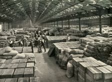 "Traffic and Merchandise Multiplied Century By Century" A Dock Transit Shed 1937. Creator: Unknown