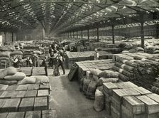 "Traffic and Merchandise Multiplied Century By Century" A Dock Transit Shed 1937. Creator: Unknown