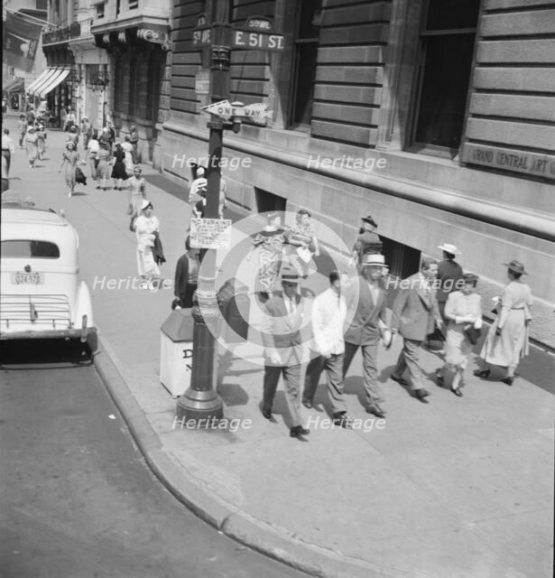 Traffic on Fifth Avenue approaching 57th Street on a summer afternoon, New York City, 1939 Creator: Dorothea Lange.