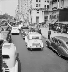 Traffic on Fifth Avenue approaching 57th Street on a summer afternoon, New York City, 1939. Creator: Dorothea Lange