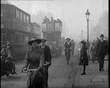 Traffic Scenes in London. Pedestrians, Cyclists, and Motorists All Passing By, 1922. Creator: British Pathe Ltd