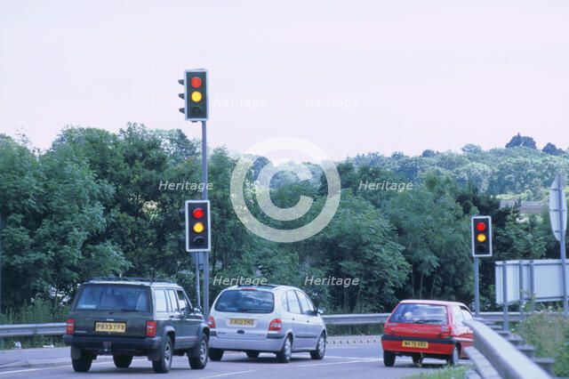 Traffic stopped at Traffic lights. Artist: Unknown.