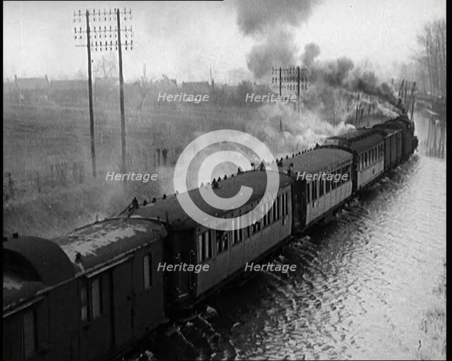 Train Driving Through Flooded Fields and Tracks, 1926. Creator: British Pathe Ltd.