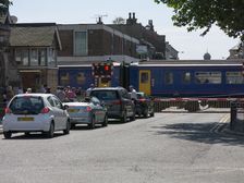 Train passing through level crossing in Lincoln 2014