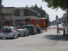 Train passing through level crossing in Lincoln 2014