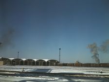 Train pulling out of the freight house at C & NW RR's Proviso Yard, Chicago, Ill., 1942. Creator: Jack Delano