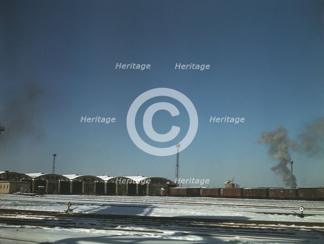 Train pulling out of the freight house at C & NW RR's Proviso Yard, Chicago, Ill., 1942. Creator: Jack Delano.