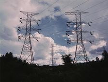 Transmission line towers and high tension lines that......Wilson Dam..., near Sheffield, Ala., 1942. Creator: Alfred T Palmer