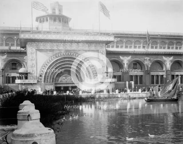 Transportation exhibit building with canal boat and ducks on canal(?) in foreground..., 1893. Creator: Frances Benjamin Johnston.