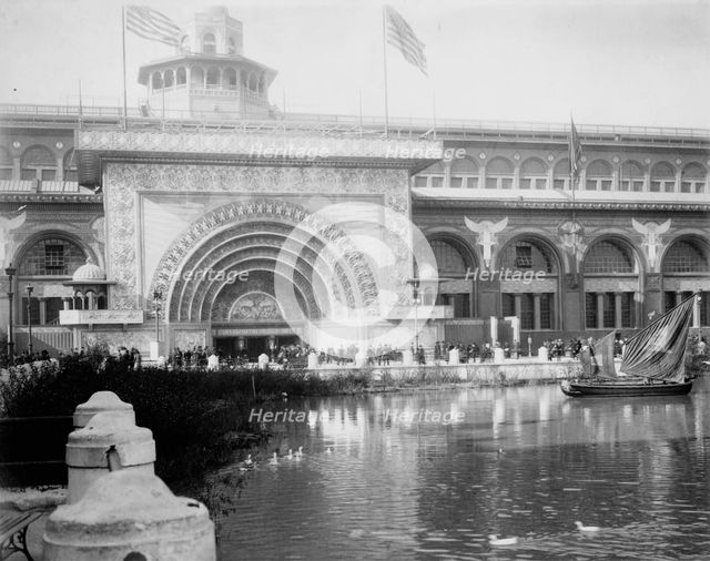 Transportation exhibit building with canal boat and ducks on canal(?) in foreground..., 1893. Creator: Frances Benjamin Johnston.