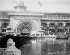 Transportation exhibit building with canal boat and ducks on canal(?) in foreground..., 1893. Creator: Frances Benjamin Johnston
