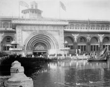 Transportation exhibit building with canal boat and ducks on canal(?) in foreground..., 1893. Creator: Frances Benjamin Johnston