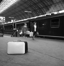 Travellers on a platform, Centraal Station, Amsterdam, Netherlands, 1963. Creator: Michael Walters