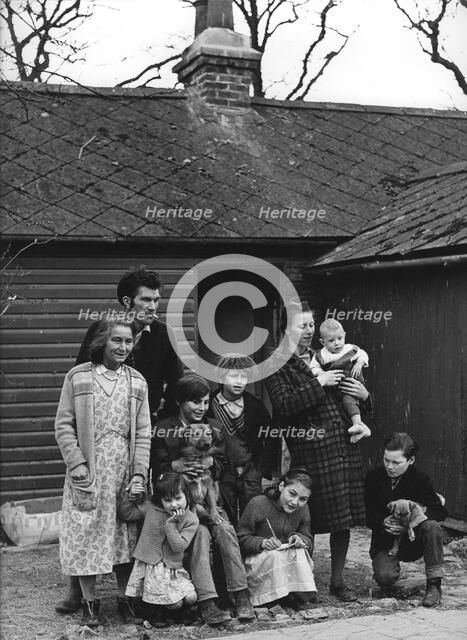 Travelling gipsy family re-housed in a bungalow, Beare Green, Surrey, 1964.