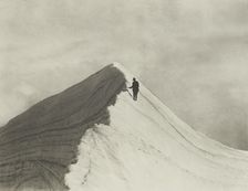 Traversing Annette wind ridge by chief guide F. Milne, Mt Cook district. From the album..., 1920s. Creator: Harry Moult
