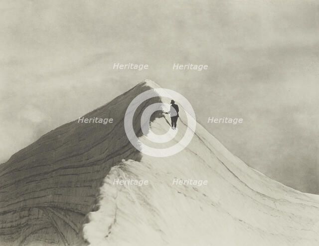 Traversing Annette wind ridge by chief guide F. Milne, Mt Cook district. From the album..., 1920s. Creator: Harry Moult.