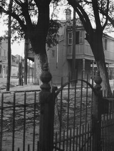 Triangular Bar, Magazine Street, New Orleans, between 1920 and 1926. Creator: Arnold Genthe