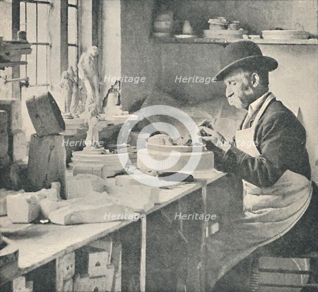 'Trimming up parts of raw clay', c1917. Artist: Unknown.