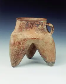 Tripod jar with strap handle and hollow legs, Qijia culture, Qinghai province, China, 1800-1500 BC. Creator: Unknown