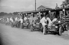 Triumph and Riley cars in the pits at the RAC TT Race, Ards Circuit, Belfast, 1929 Artist: Bill Brunell