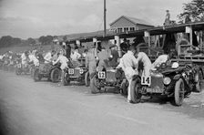 Triumph and Riley cars in the pits at the RAC TT Race, Ards Circuit, Belfast, 1929 Artist: Bill Brunell