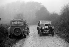 Triumph of J Cramer-Parry passing an official's Riley, MCC Exeter Trial, Blackhill, Dorset, 1930. Artist: Bill Brunell