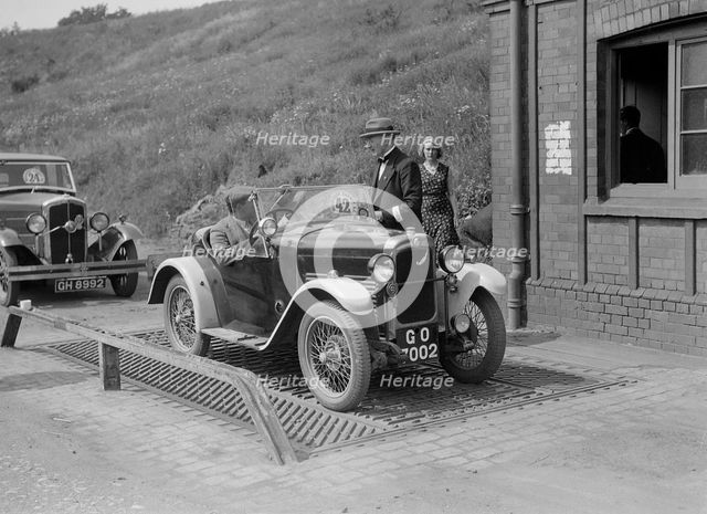 Triumph of J Wallis, winner of the Autocar Cup at the Middlesex County AC Hill Climb, c1930. Artist: Bill Brunell.