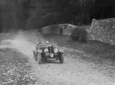 Triumph open tourer competing in a motoring trial, Nailsworth Ladder, Gloucestershire, 1930s.. Artist: Bill Brunell