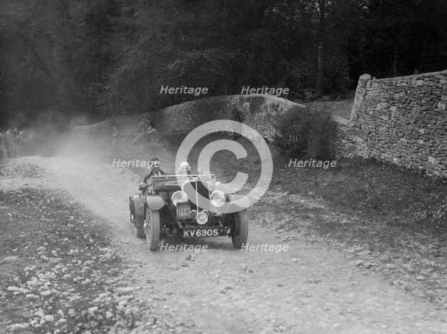 Triumph open tourer competing in a motoring trial, Nailsworth Ladder, Gloucestershire, 1930s.. Artist: Bill Brunell.