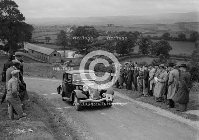 Triumph saloon of KN Smith competing in the South Wales Auto Club Welsh Rally, 1937 Artist: Bill Brunell.